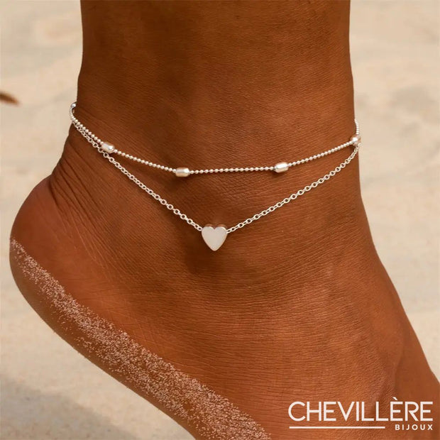 Chaîne de cheville argentée avec pendentif cœur